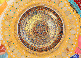 Circular ceramic pattern background on wall in Wat Phasornkaew in Phetchabun, Thailand.