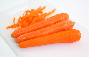 Carrot and peel isolated on white background.