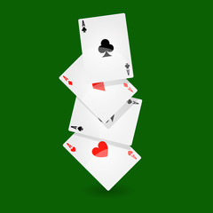 Playing cards set of four on green background