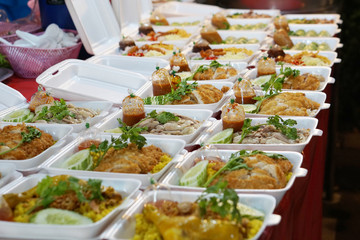 take away food to go at thailand night market with chicken or pork
