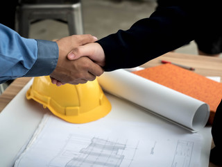 Close-up of business engineer planing at construction site project, documents, worker tool