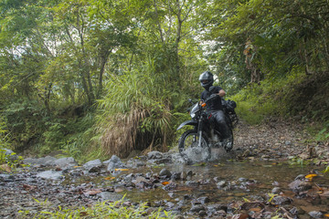 Motorcycle riding on a stream of water