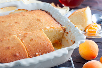 Homemade apricot pie in ceramic form, breakfast, selective focus