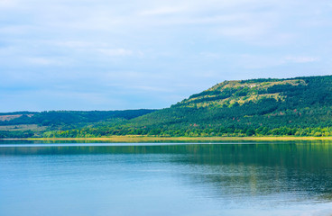 Photo of a beautiful beach near blue bay at summer