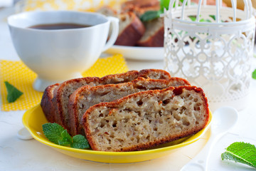 Homemade banana bread sliced on a table close-up. horizontal, rustic style