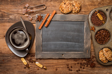 Cup of coffee and chalk board menu 