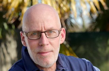 Portrait of a mature man relaxing in the garden