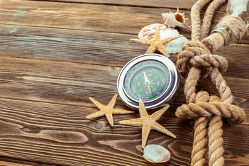 Seashells border on wood. Marine background