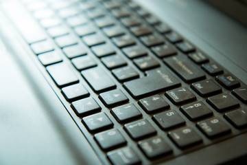 Modern laptop keyboard in the sunlight