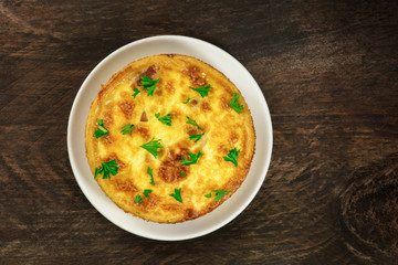 Overhead photo of French quiche on rustic texture