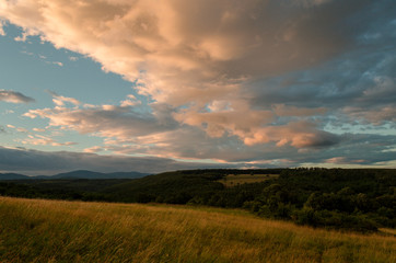 Cloudy sunny landscape scene in nature in the summer while hiking 