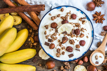 Serving of White Yogurt with  Muesli, Banana and Nuts