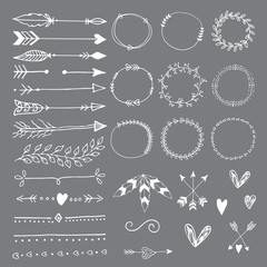 Collection of hand drawn wedding design elements, arrows, circles boders hearts and feathers.