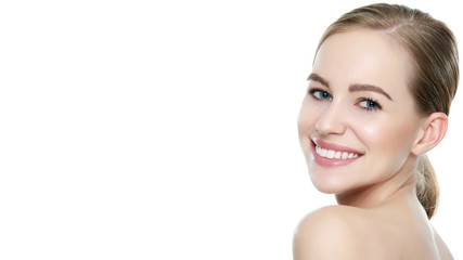 Beautiful young blond smiling woman with clean skin, natural make-up and perfect white teeth white...