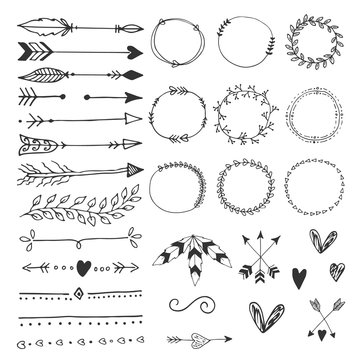Collection of hand drawn wedding design elements, arrows, circles boders hearts and feathers.