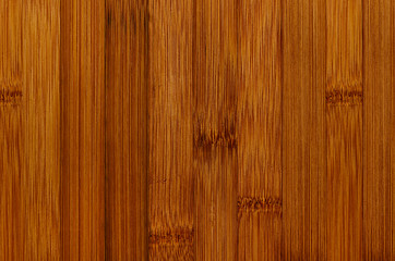 Bamboo brown wood texture, vertical plank, top view, closeup.