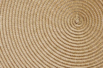 Fototapeta na wymiar Closeup of a woven straw background. Top view