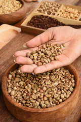 Freshly coffee beans on hand for background