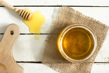Jar of honey on the table./Jar of honey on the table 