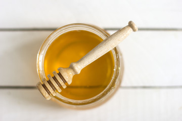 Jar of honey on the table./Jar of honey on the table 
