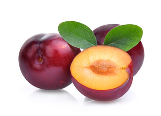 red cherry plum, tropical fruit with green leaves isolated on white background