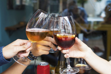 hands of friends toasting with beer