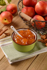 Homemade peach jam with fruit around