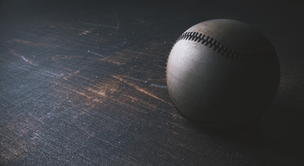 Baseball on wooden desk