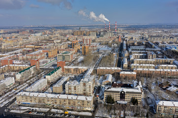 Tyumen, Russia - February 14, 2016: Aerial view onto residential area, office buildings of Sberbank and GEOTEK Seismic exploration with power station on background