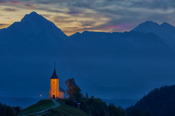 Fototapeta na wymiar St. Primoz church in Jamnik at sunrise, Slovenia