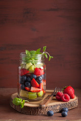 fruit salad in mason jar strawberry blueberry kiwi apple mint