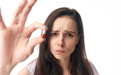 Fototapeta premium Woman sick, woman with pill on isolated background