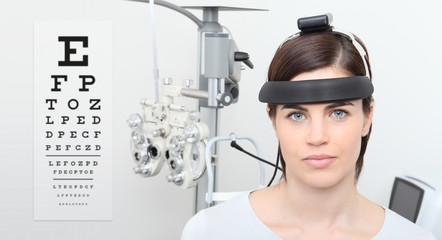 woman doing eyesight measurement, balance test and visual chart background, eye examination...