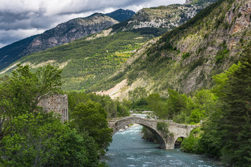Fototapeta na wymiar Stone crossing over river in Alps,France
