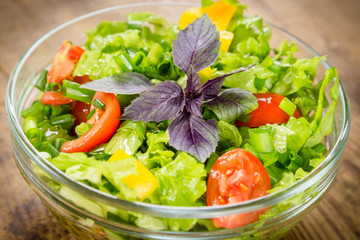 Plenty of cut vegetables on glass bowl