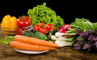 Plenty of vegetables on rustic wooden table