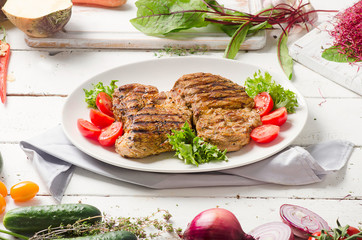 Grilled pork steak and vegetable salad