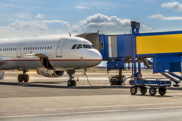 Passenger jet airplane on gate terminal