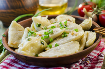 Dumplings with potatoes and cabbage meat - obrazy, fototapety, plakaty