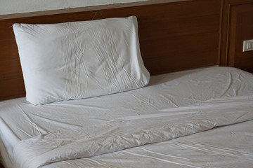 Fototapeta na wymiar already used hotel bed