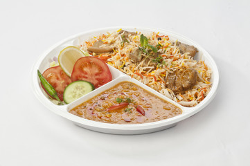 Indian meal combo with Chicken biryani and daal mash  in disposable plate