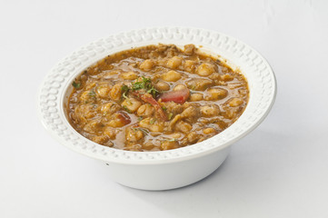 chole chana masala in white disposable bowl