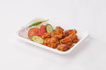 Boneless chicken tikka with mint dip and fresh salad