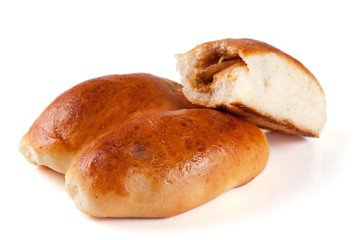 three homemade pies with cabbage isolated on white background