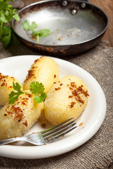 Potato dumplings stuffed with minced meat.