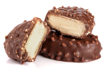 chocolate candy with white cream filling isolated on white background