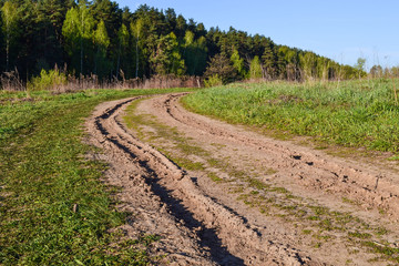 Fototapeta na wymiar dirt road leading to the church. Russia