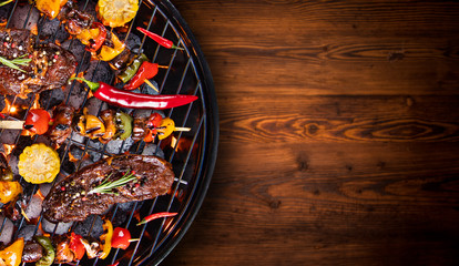 Barbecue grill with beef steaks, close-up. © Lukas Gojda