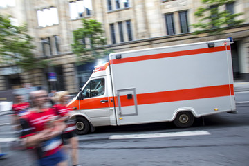 speeding ambulance car in a city