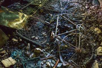 Inside the burnt house, a charred bicycle, remains of a mattress and furniture